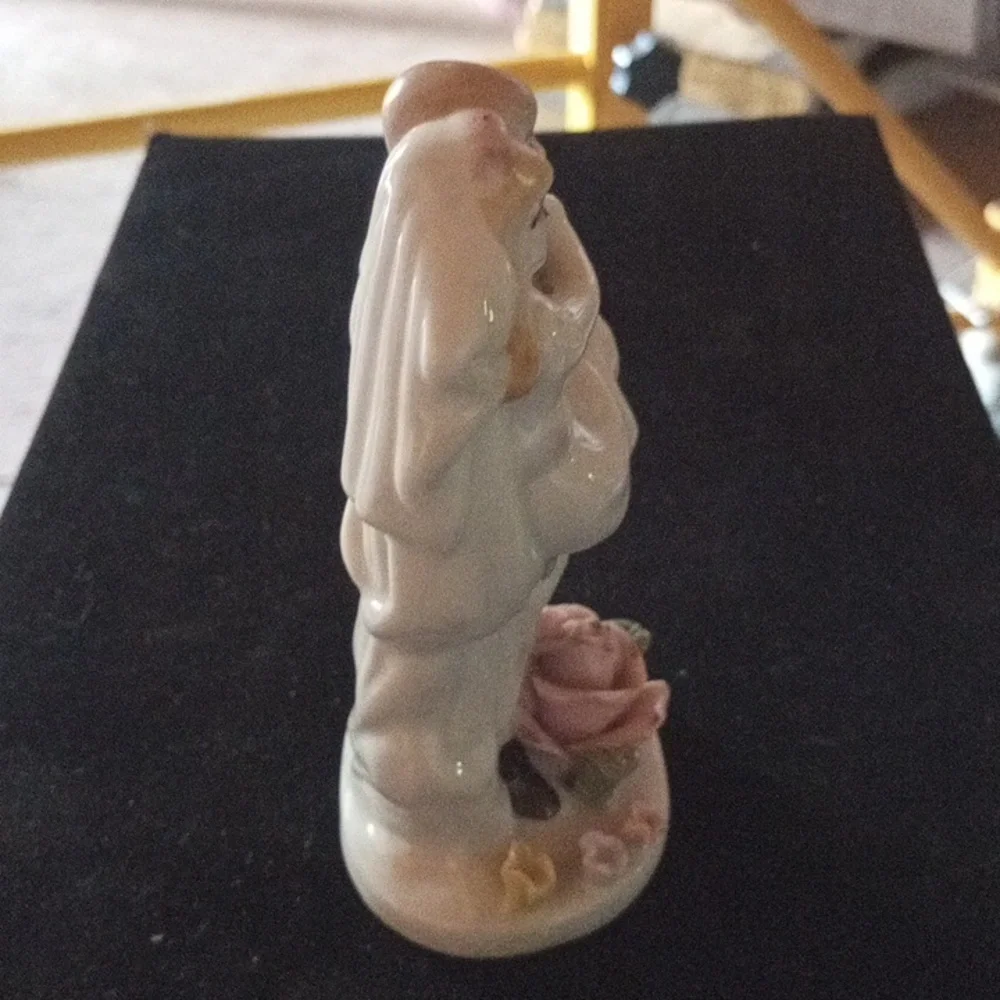 Porcelain Figurine with Floral Base